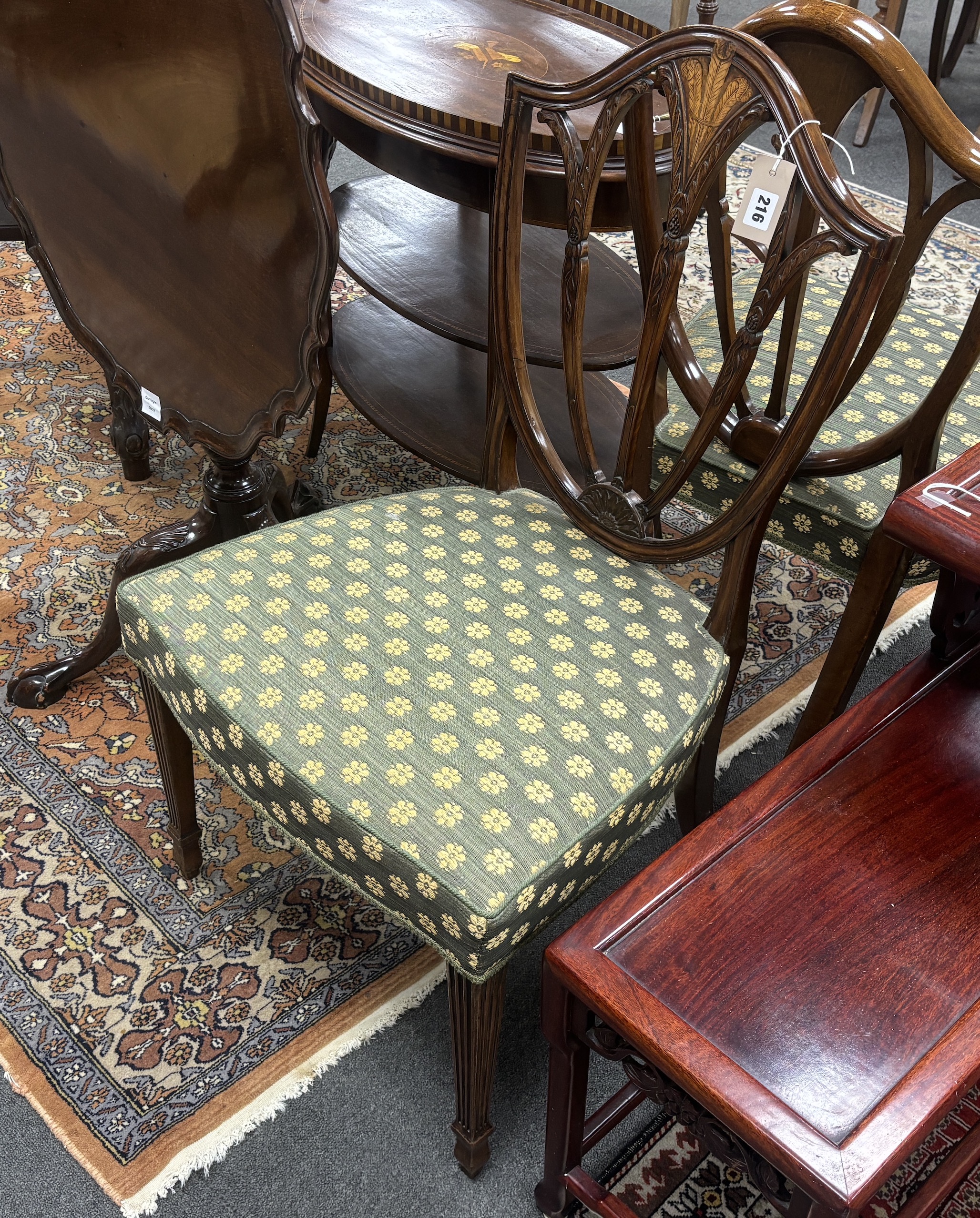 A pair of George III inlaid mahogany dining chairs